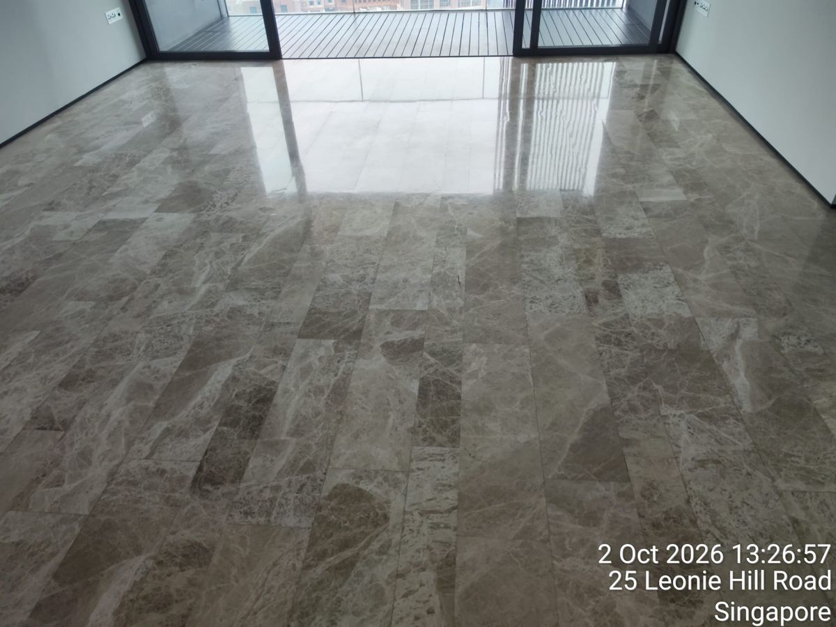 Polished Emperador marble floor in a River Valley condo living room