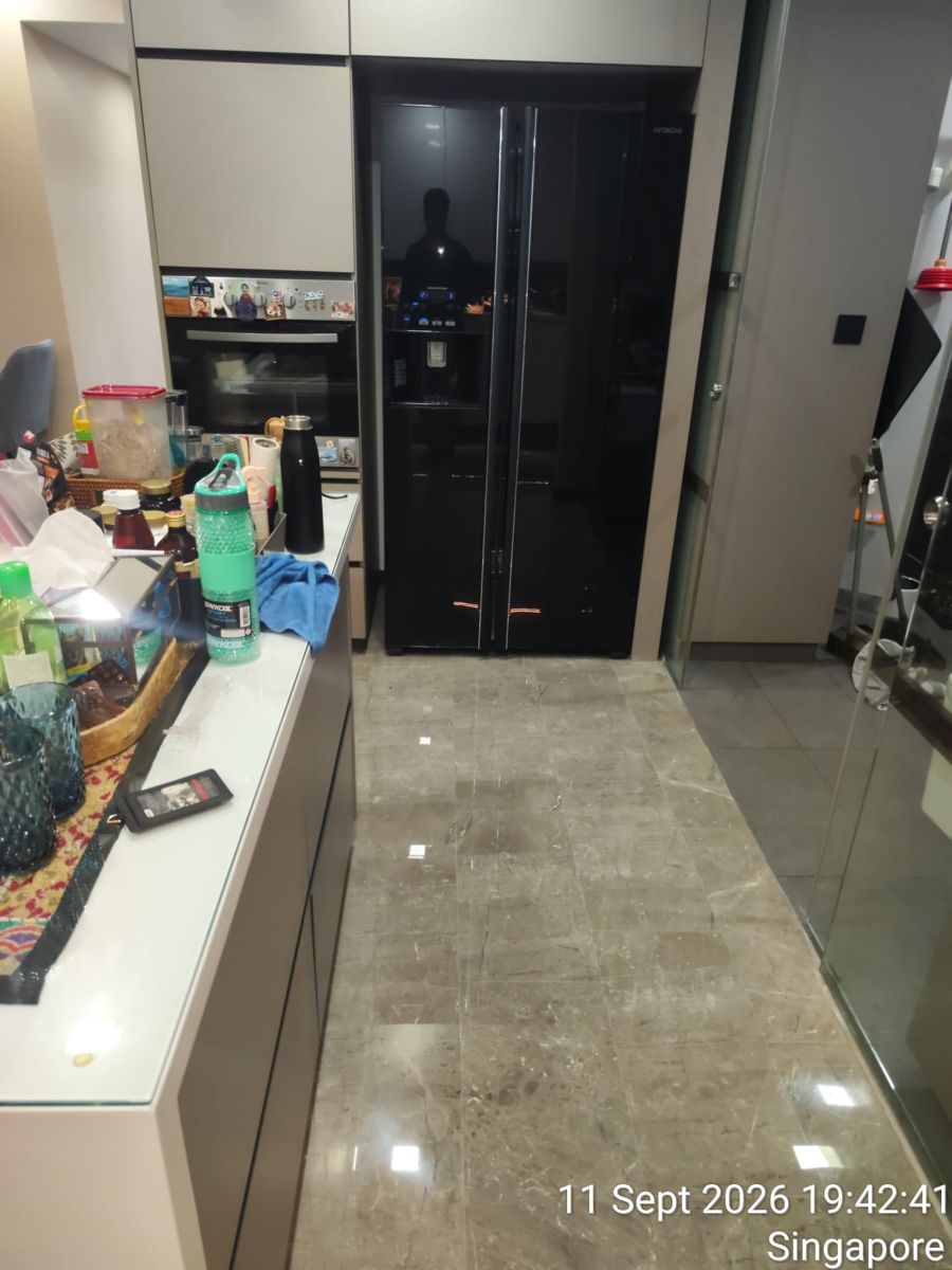 Polished grey marble floor in a condo kitchen