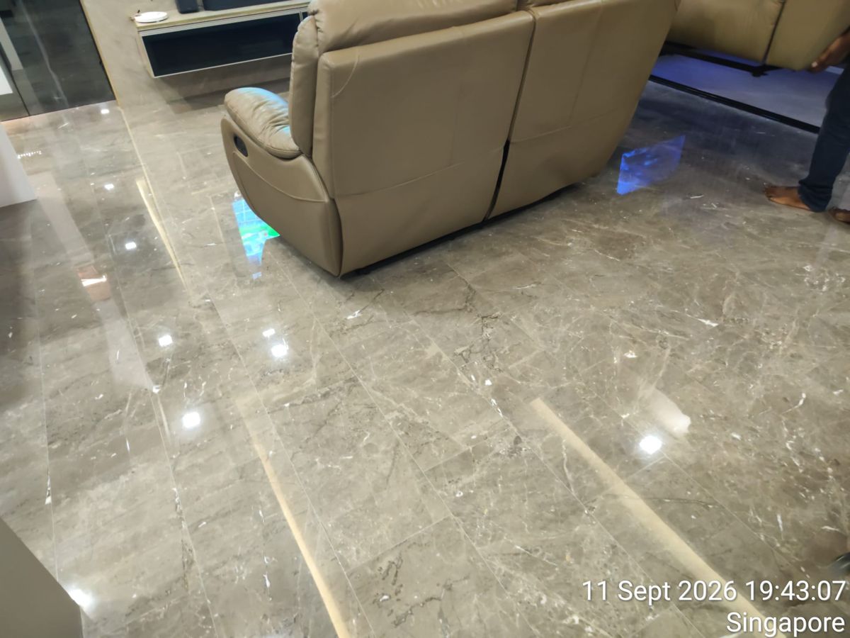 Grey marble floor with the sofa reflected after polishing