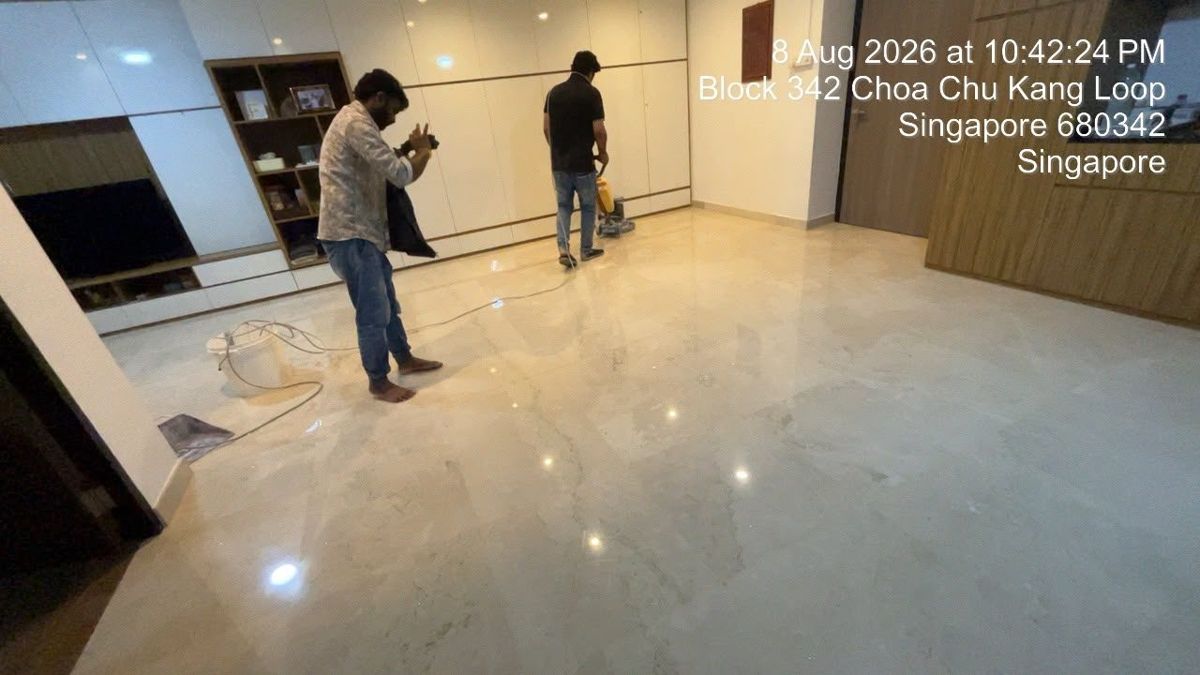 Team grinding a cream marble living room floor