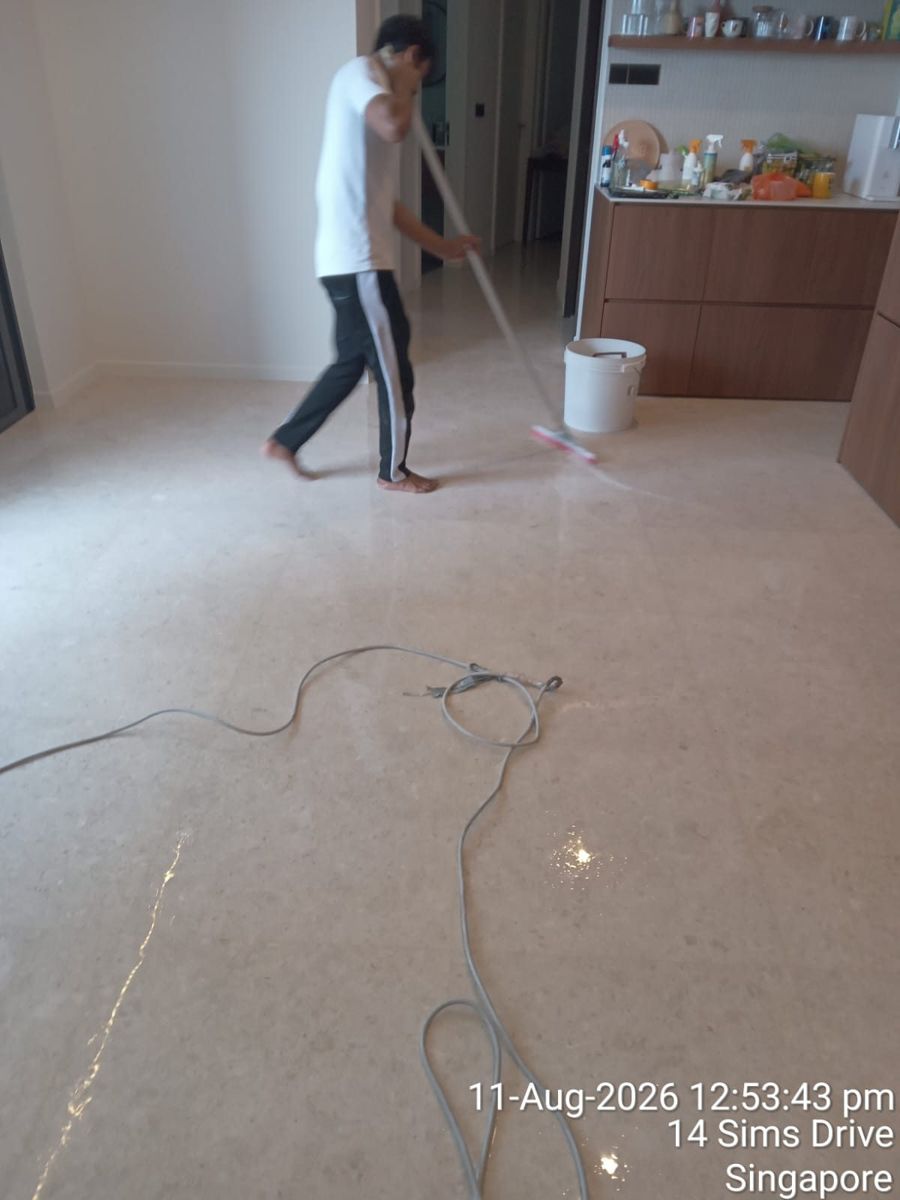 Technician doing the final buff on a marble floor