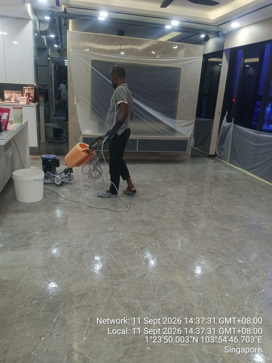Marble polishing with plastic sheeting protecting the walls
