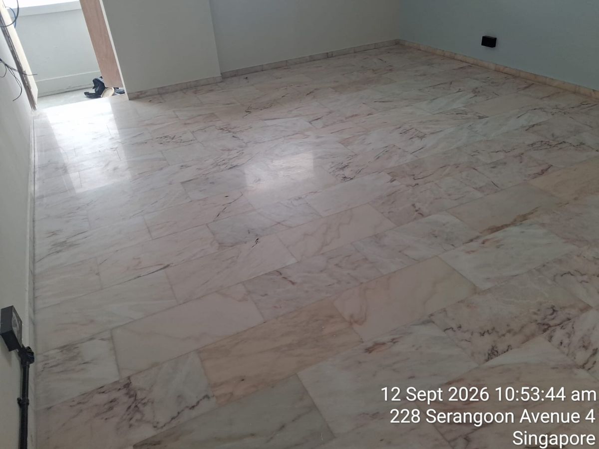 Pink-veined marble floor in an empty room